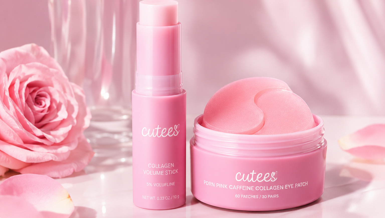 Pink skincare set from cutees, featuring a Collagen Volume Stick and a Corn Pink Caffeine Collagen Eye Patch jar, styled with a pink rose and petals on a white surface.